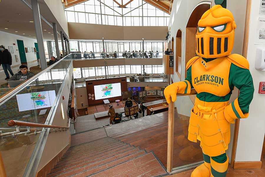 Golden Knight standing in the Student Center